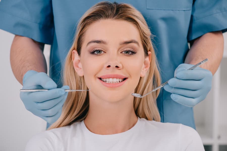 los-angeles-dentist-showing-patient-dental-bonding-results
