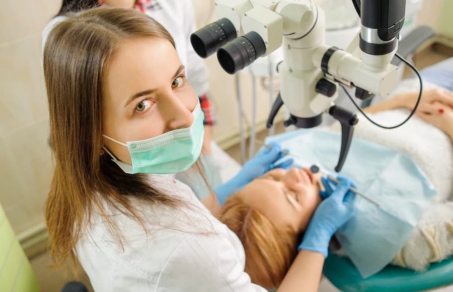 root-canal-endodentist-in-los-angeles-treating-caries-using-microscope