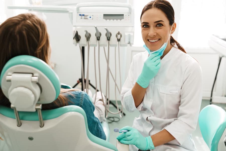 woman-cosmetic-dentist-in-la-smiling-while-working
